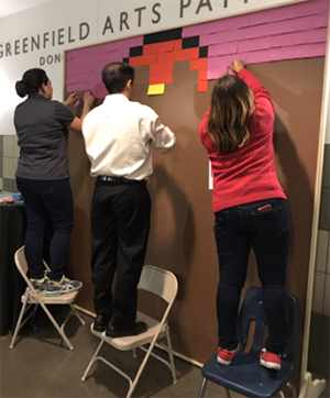 Volunteer setting up TEDxKids@ElCajon 2017